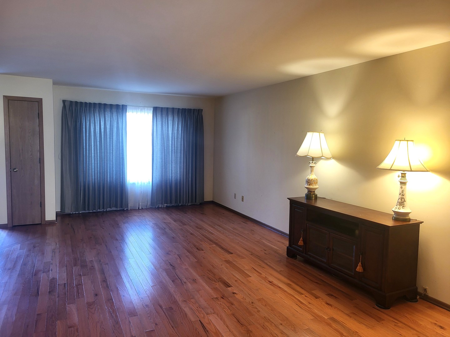 434 East Exchange Street, Unit 2 Sycamore, IL 60178 - Photo 3 of 15 a view of empty room with wooden floor