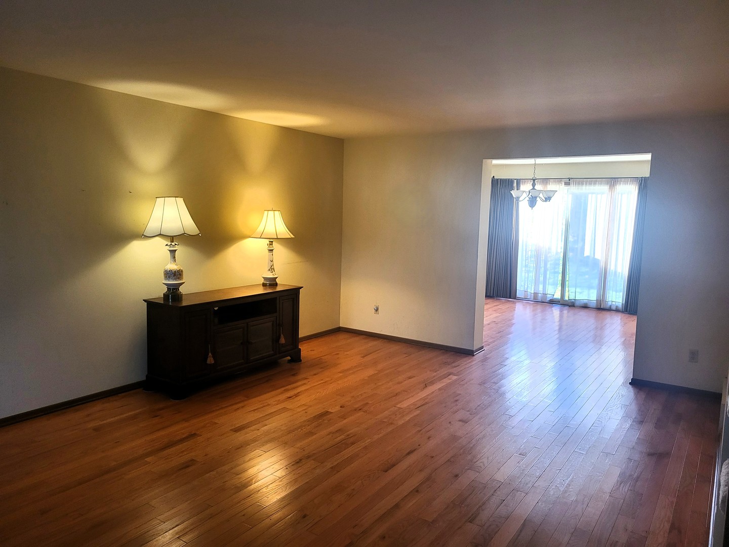 434 East Exchange Street, Unit 2 Sycamore, IL 60178 - Photo 4 of 15 a room with wooden floors and lamp