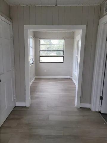 a view of wooden floor in an empty room