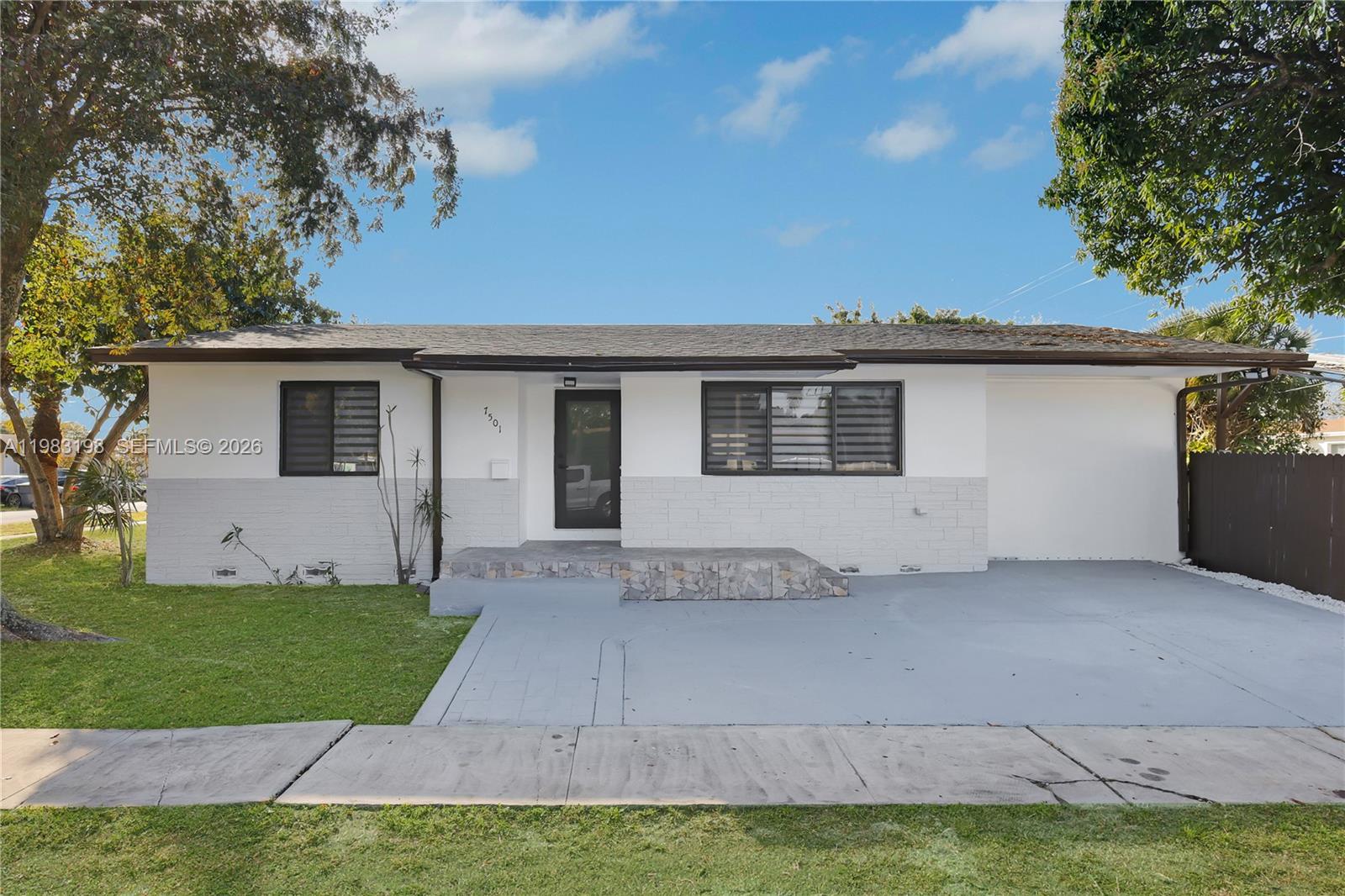 7501 Raleigh Street Hollywood, FL 33024 - Photo 1 of 21 a view of a house with a backyard