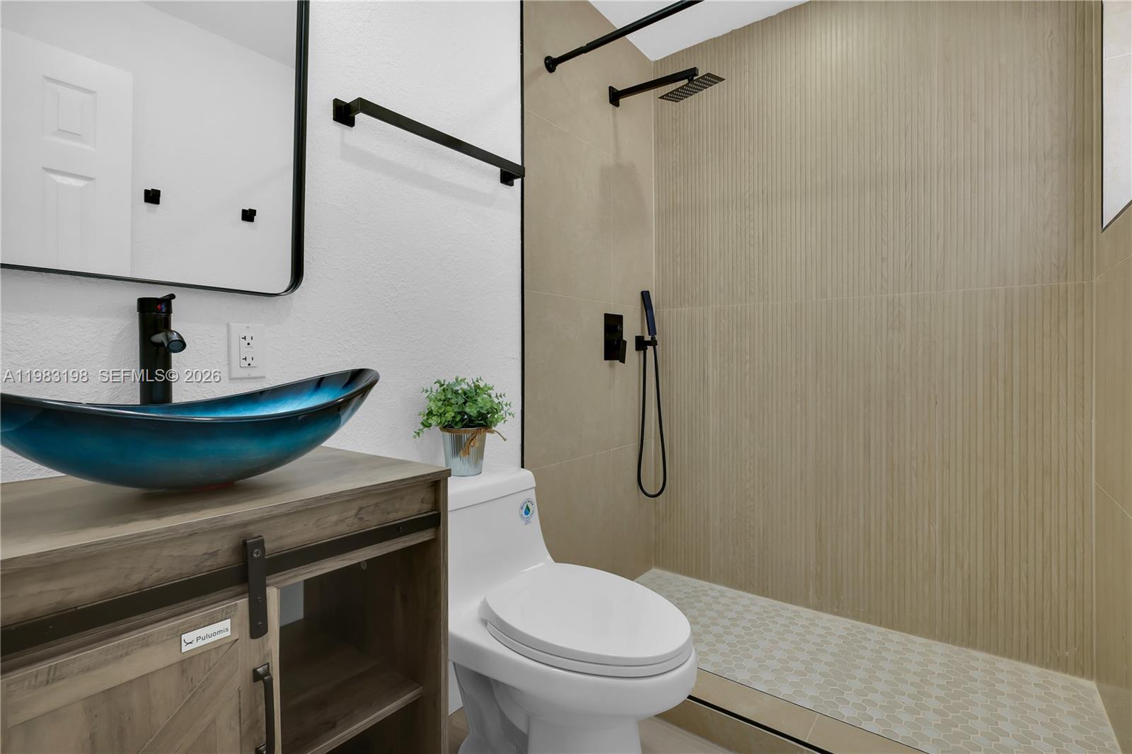 7501 Raleigh Street Hollywood, FL 33024 - Photo 11 of 21 a bathroom with a granite countertop toilet sink and shower