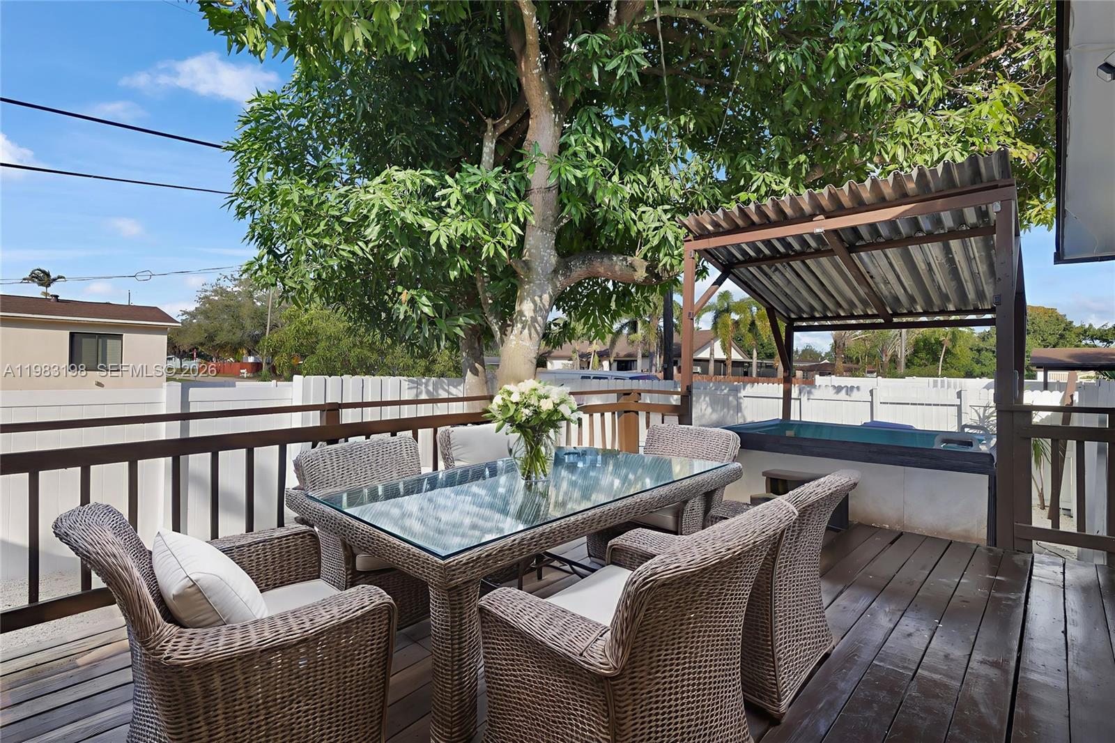 7501 Raleigh Street Hollywood, FL 33024 - Photo 12 of 21 a view of balcony with outdoor seating and wooden floor