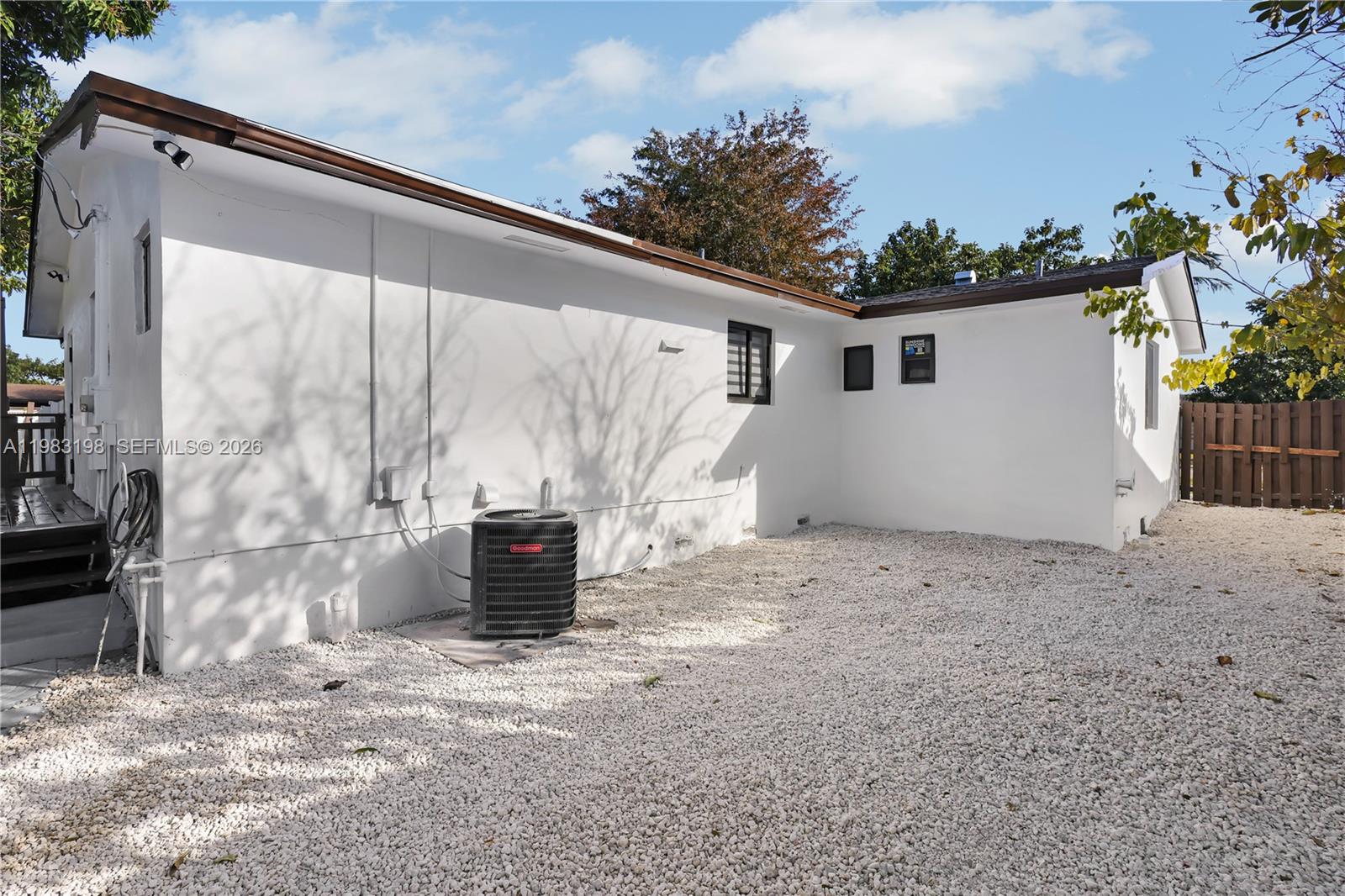 7501 Raleigh Street Hollywood, FL 33024 - Photo 14 of 21 a backyard of a house with barbeque oven and outdoor seating