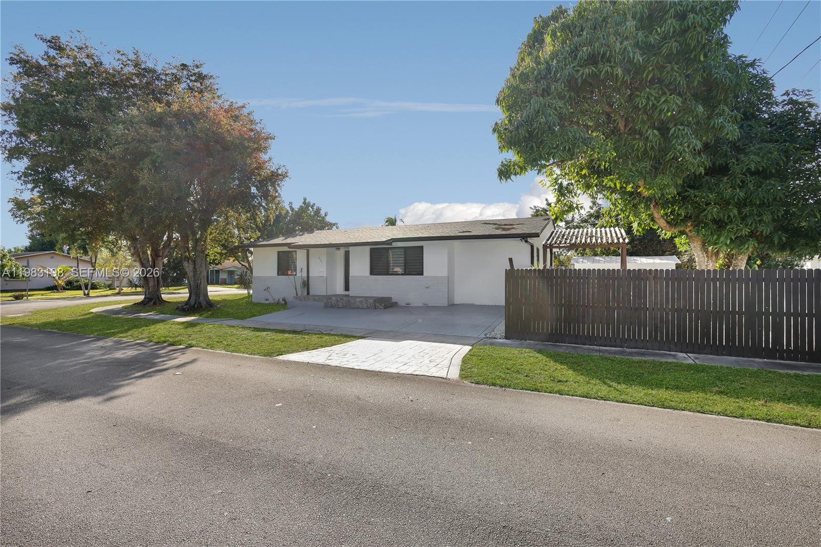 7501 Raleigh Street Hollywood, FL 33024 - Photo 18 of 21 a view of road with house in background