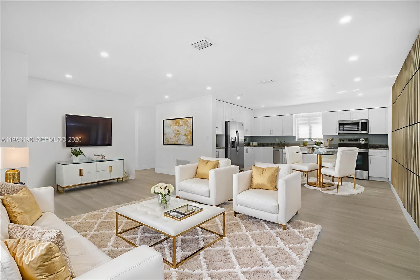 7501 Raleigh Street Hollywood, FL 33024 - Photo 3 of 21 a living room with furniture and a flat screen tv