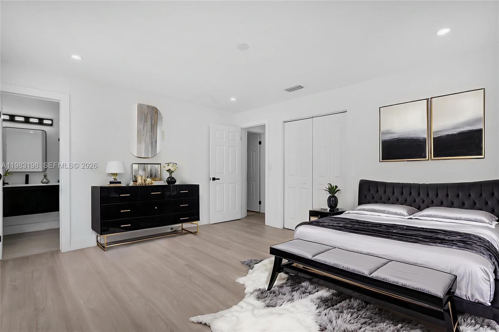 7501 Raleigh Street Hollywood, FL 33024 - Photo 5 of 21 a bedroom with a bed and a dresser