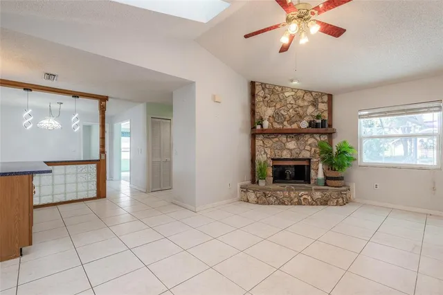 a view of livingroom with furniture flat screen tv and windows