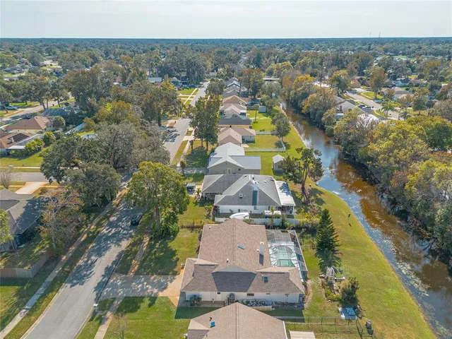 an aerial view of residential houses with outdoor space