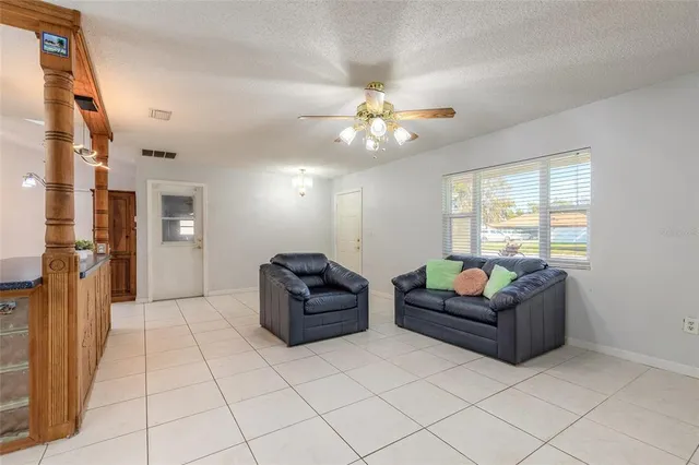 a living room with furniture and a window