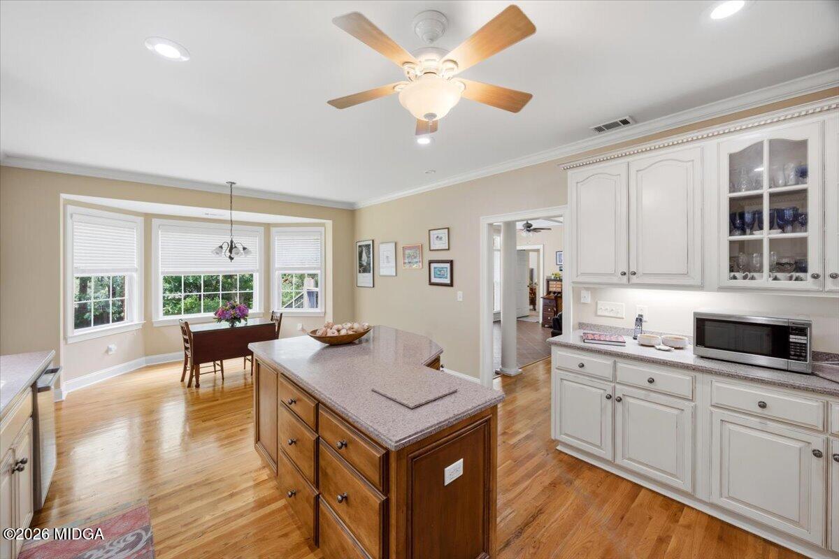 210 Oberon Place Macon, GA 31210 - Photo 16 of 31 a living room with kitchen island furniture and a large window