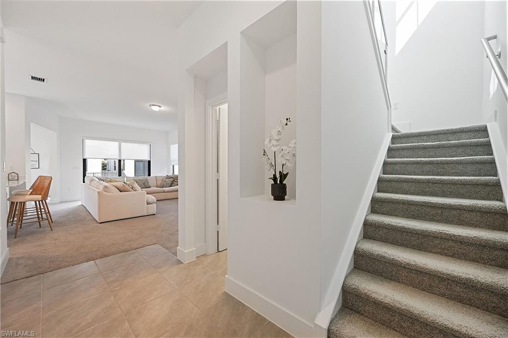 5617 Cobalto Way Avenue Immokalee, FL 34142 - Photo 2 of 35 a view of a livingroom with furniture and stairs