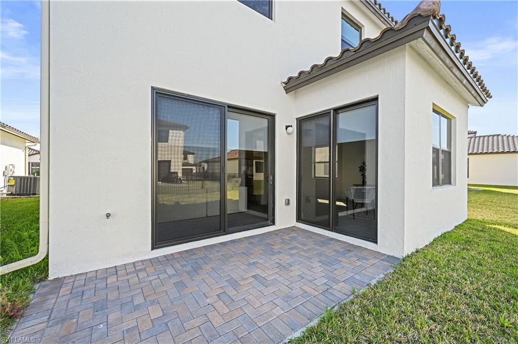 5617 Cobalto Way Avenue Immokalee, FL 34142 - Photo 33 of 35 a view of a house with a yard