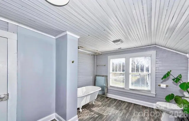 a bathroom with a toilet a sink and shower