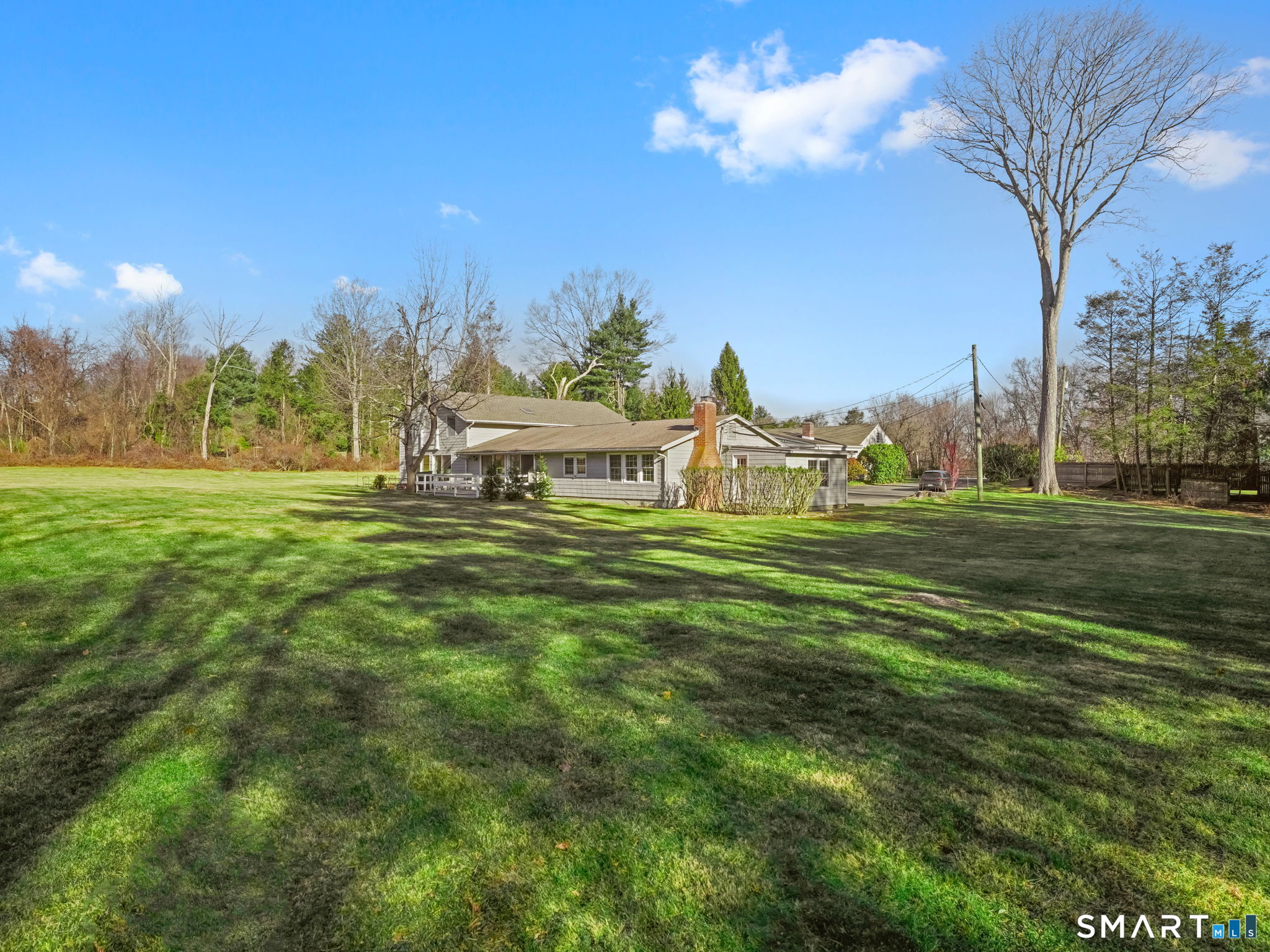 21 Richdale Drive, Unit C Wilton, CT 06897 - Photo 2 of 10 a view of a park with large trees