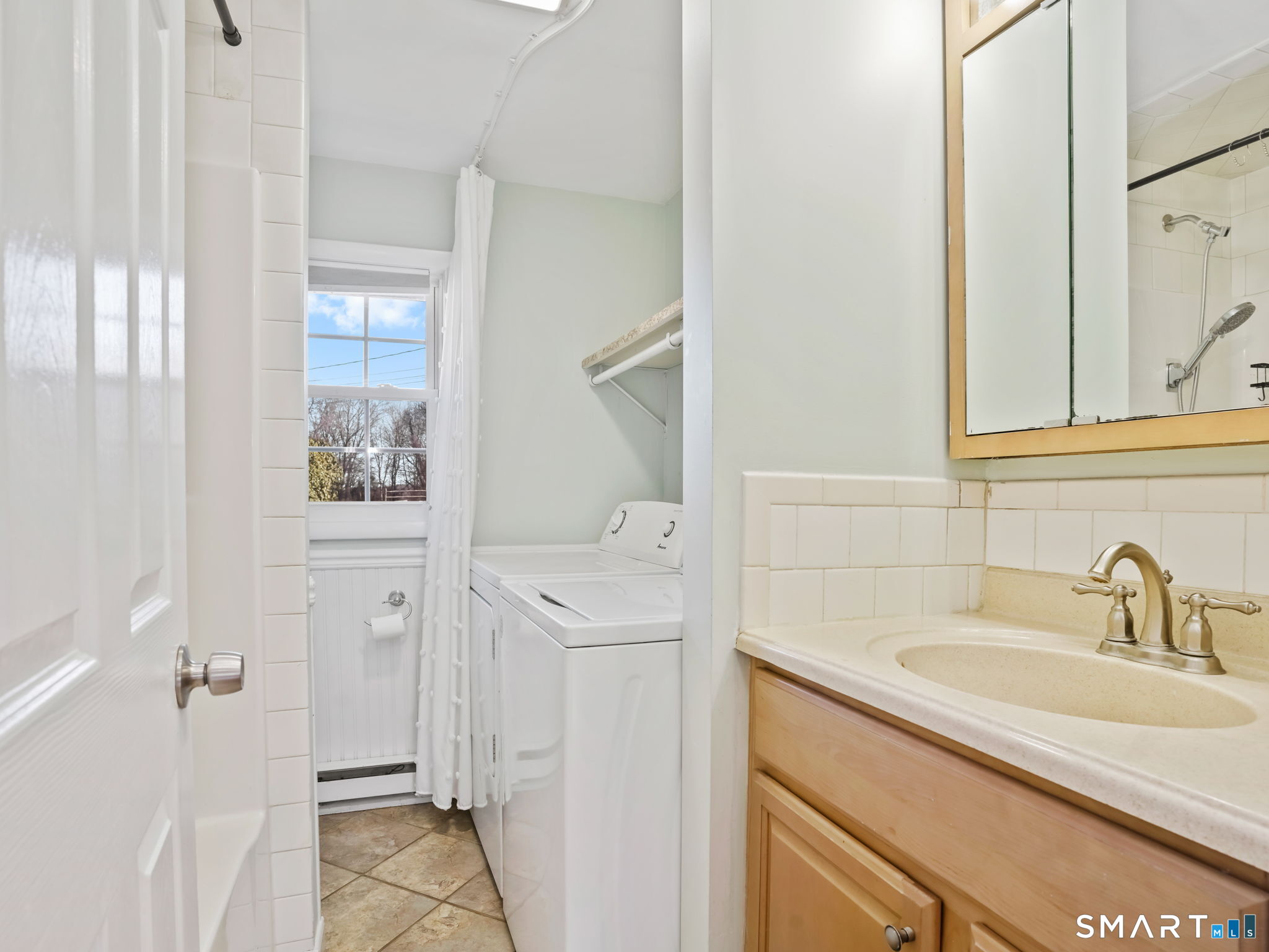 21 Richdale Drive, Unit C Wilton, CT 06897 - Photo 6 of 10 a bathroom with a sink and mirror