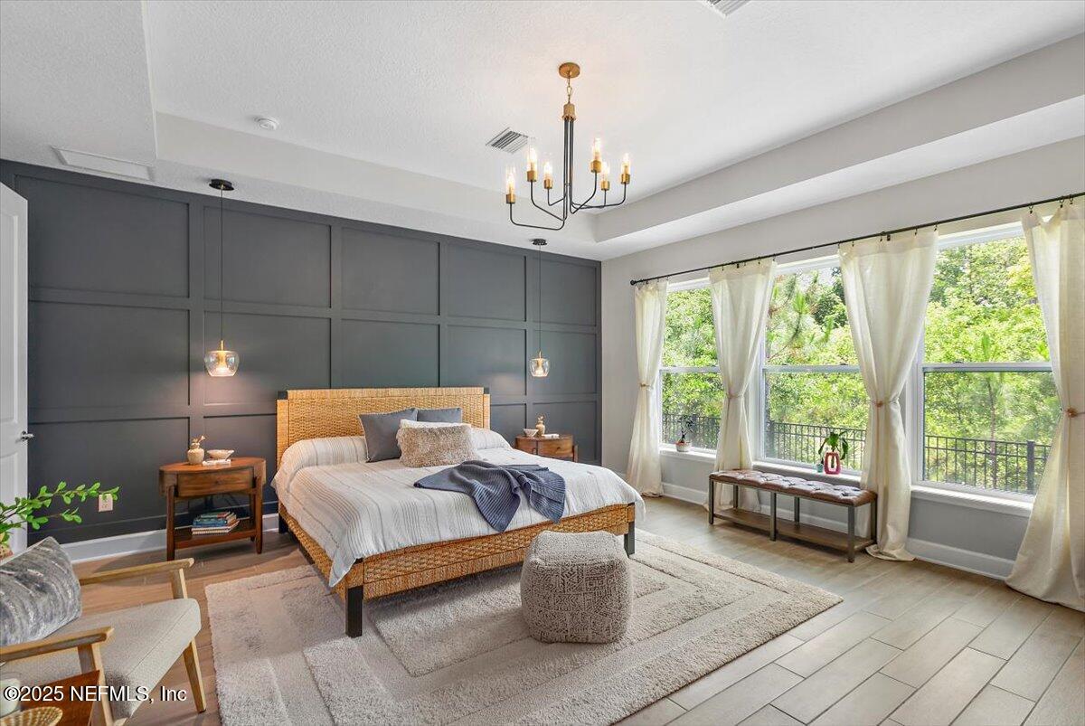 169 Rivercliff Trail St. Augustine, FL 32092 - Photo 19 of 49 a living room with furniture and a chandelier