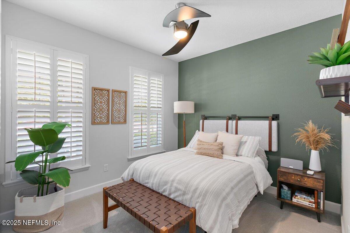 169 Rivercliff Trail St. Augustine, FL 32092 - Photo 6 of 49 a bedroom with a bed and a potted plant
