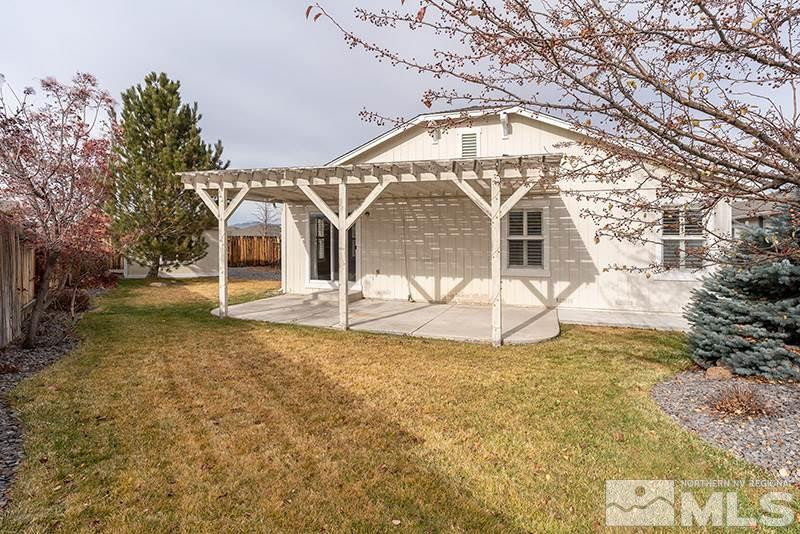7650 Bichon Street Reno, NV 89506 - Photo 13 of 15 a view of a house with a yard