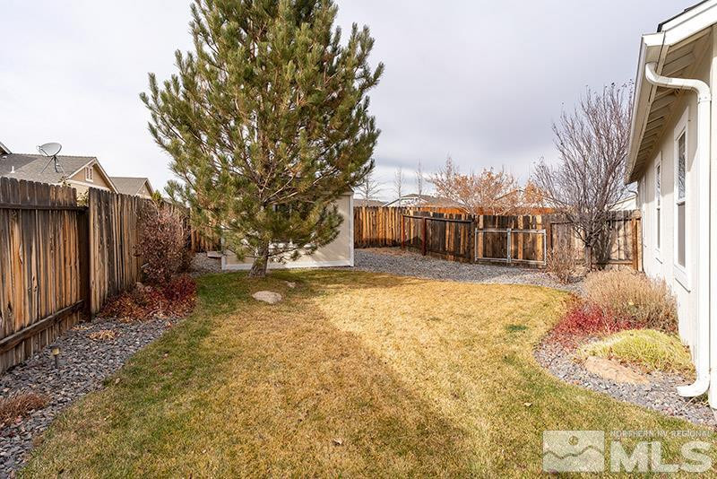 7650 Bichon Street Reno, NV 89506 - Photo 14 of 15 a view of a yard with a house