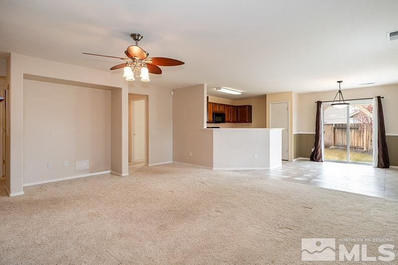 7650 Bichon Street Reno, NV 89506 - Photo 3 of 15 a view of a livingroom with a chandelier fan