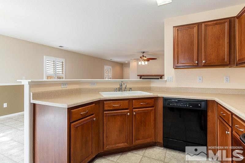 7650 Bichon Street Reno, NV 89506 - Photo 6 of 15 a kitchen with a sink and cabinets