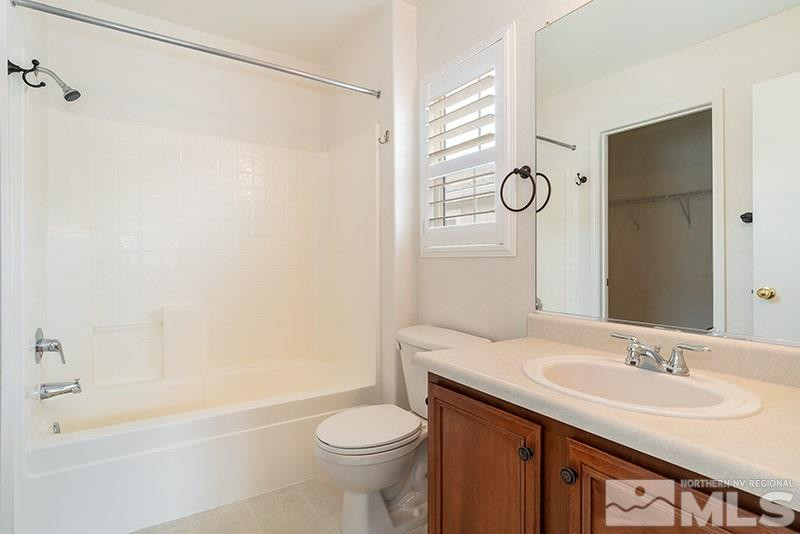 7650 Bichon Street Reno, NV 89506 - Photo 8 of 15 a bathroom with a sink a toilet and shower