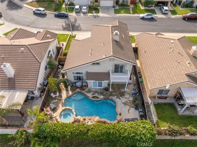 an aerial view of a house with outdoor space patio and swimming pool