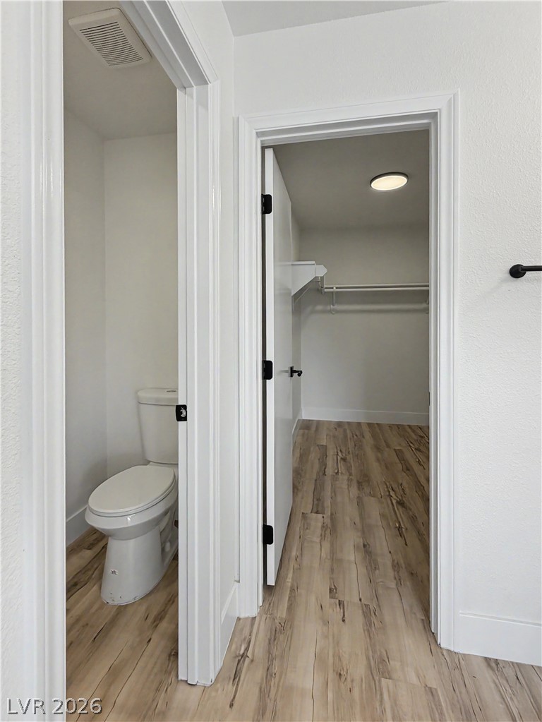 8977 Paige Rene Court Las Vegas, NV 89117 - Photo 5 of 31 Clean lines define this bright interior, featuring durable flooring and an adjacent private water closet.