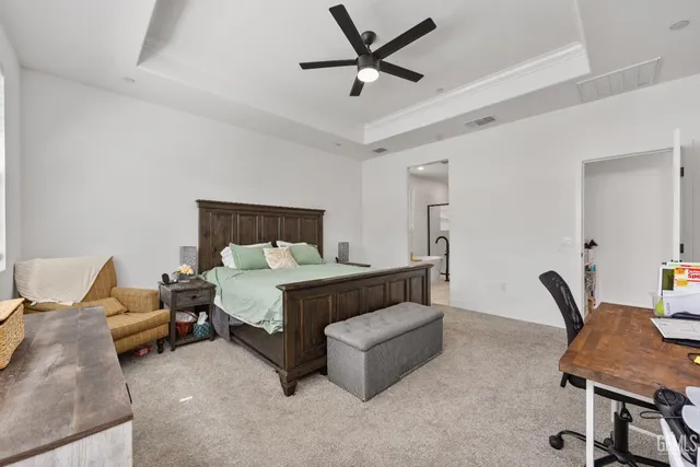 a bed room with a bed and a chair