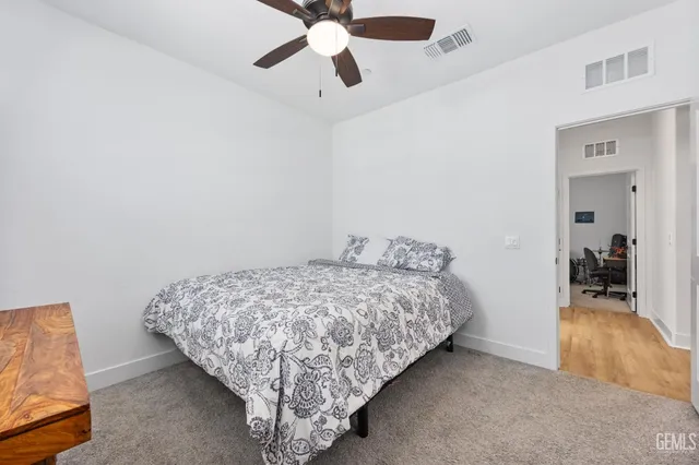 a bedroom with bed and window