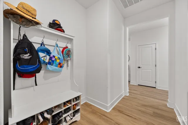 a view of an entryway with wooden floor