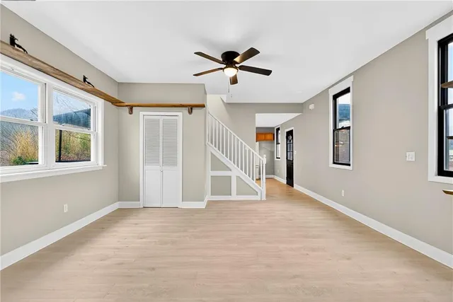 a view of an empty room with a window