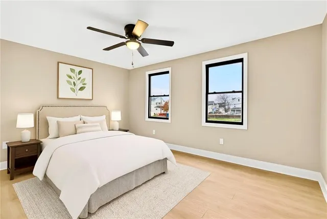 a bedroom with a large bed and a window