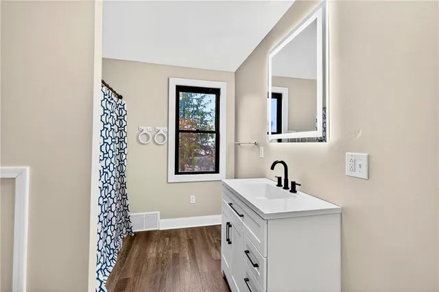 a bathroom with a sink and a mirror