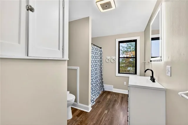 a bathroom with a sink and a large mirror