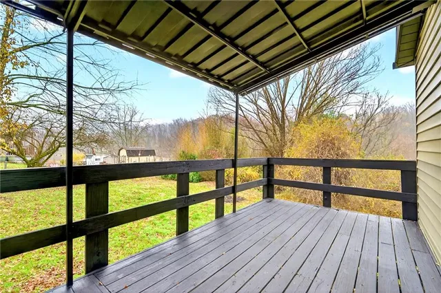 a view of outdoor space with wooden floor