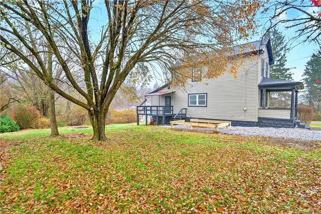 a house with trees in front of it