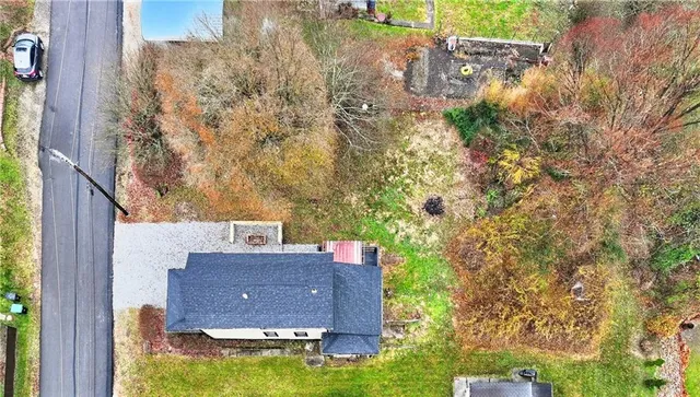 aerial view of a house with a yard
