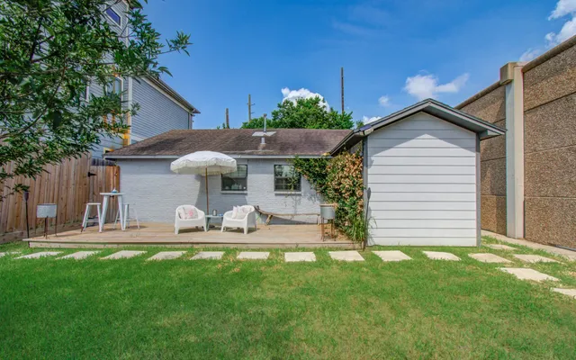 a front view of house with yard and seating area