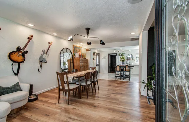 a view of a dining room with furniture window and wooden floor