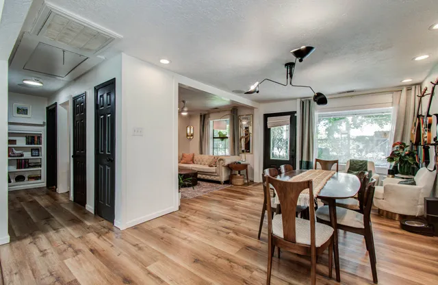a view of a dining room with furniture window and wooden floor