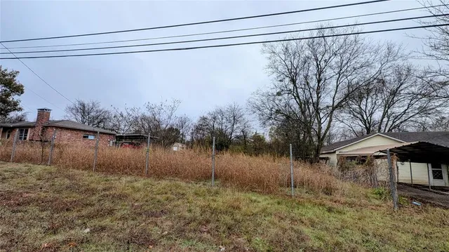 a view of a lake with a house in the background