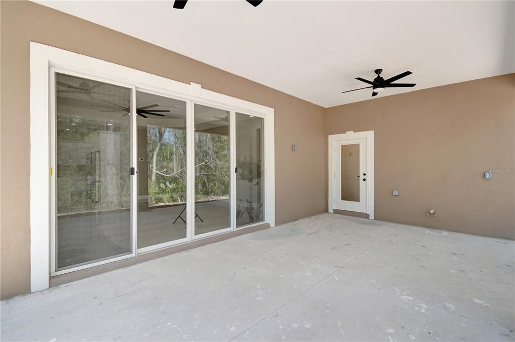 4869 Northwest 101st St Road Ocala, FL 34482 - Photo 34 of 48 Lanai with pocket doors