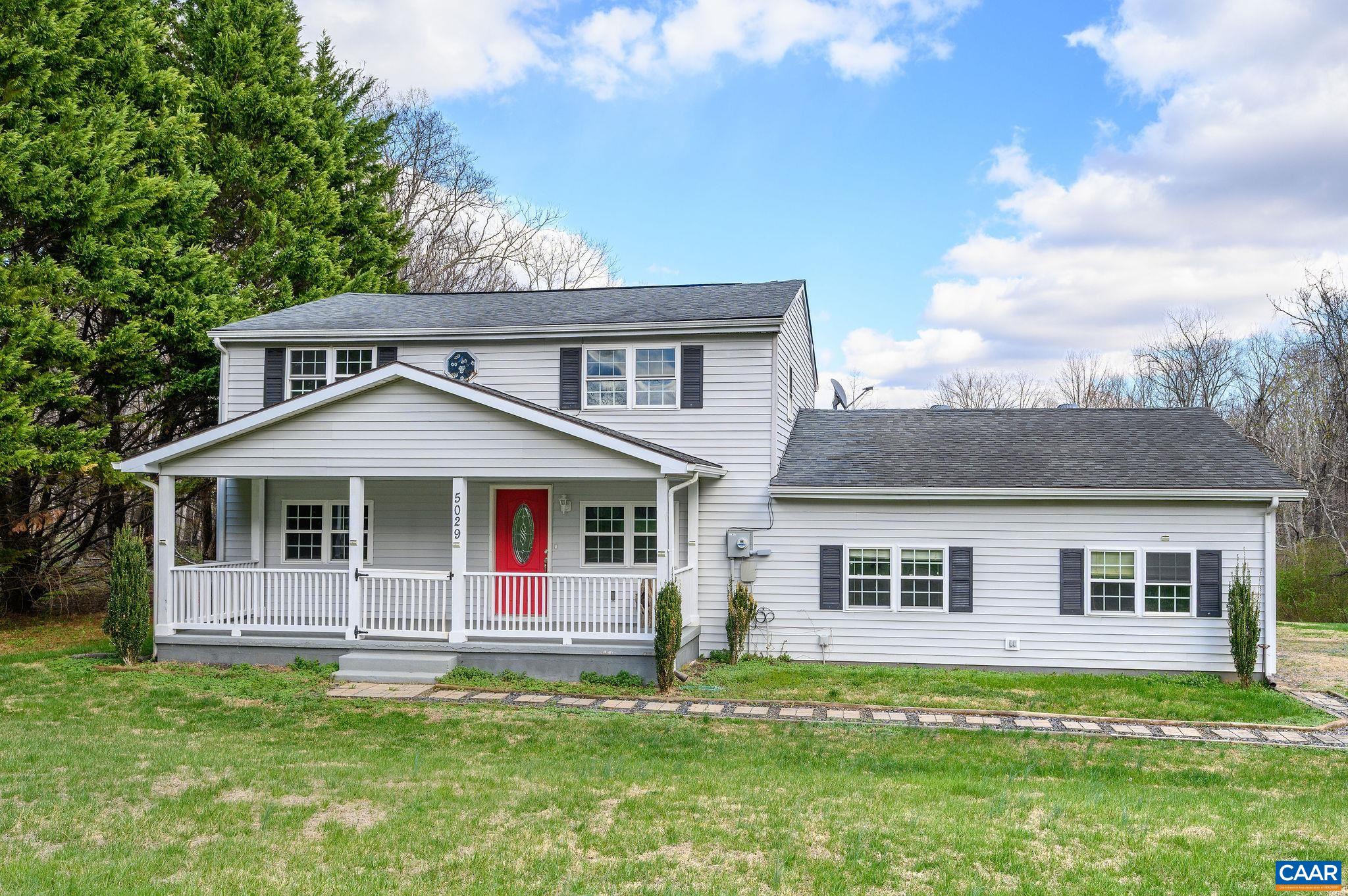 5029 Green Creek Road Schuyler, VA 22969 - Photo 2 of 27 a front view of a house with a garden