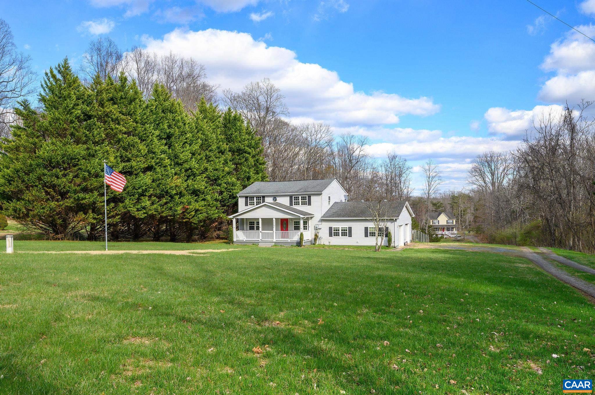 5029 Green Creek Road Schuyler, VA 22969 - Photo 26 of 27 a view of a house with a big yard and large trees