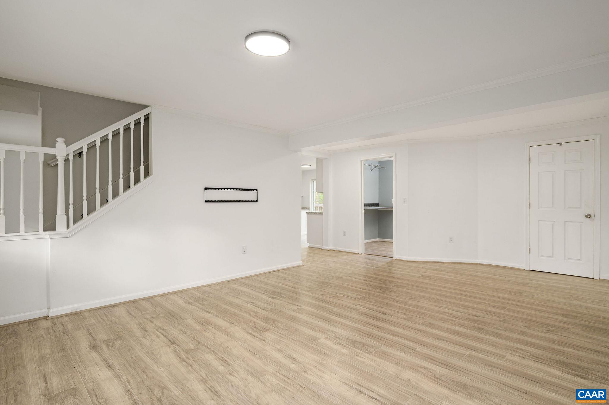 5029 Green Creek Road Schuyler, VA 22969 - Photo 5 of 27 a view of an empty room with wooden floor and a window
