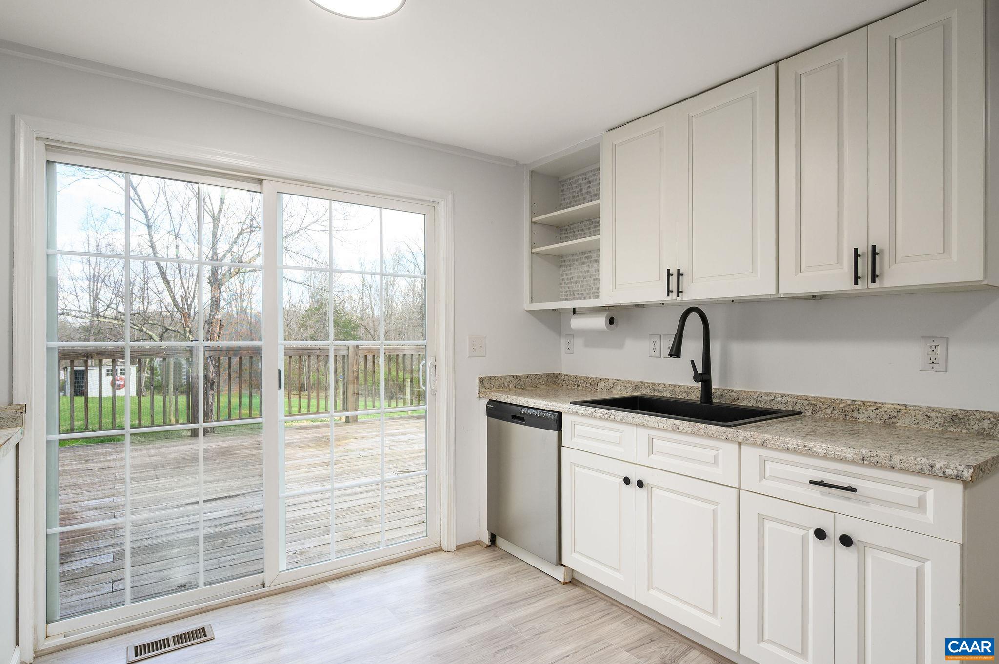 5029 Green Creek Road Schuyler, VA 22969 - Photo 7 of 27 a kitchen with granite countertop a sink and cabinets