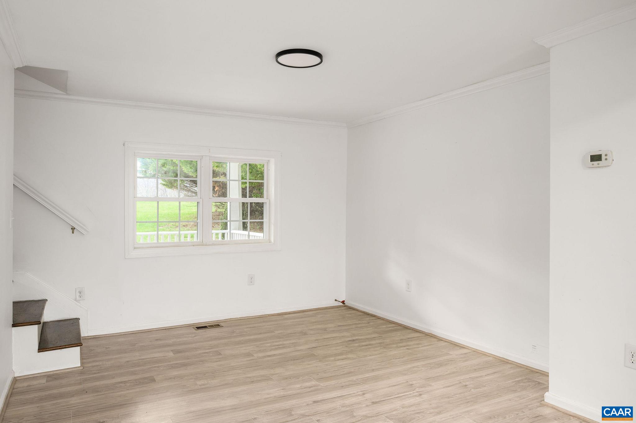 5029 Green Creek Road Schuyler, VA 22969 - Photo 8 of 27 an empty room with wooden floor and windows