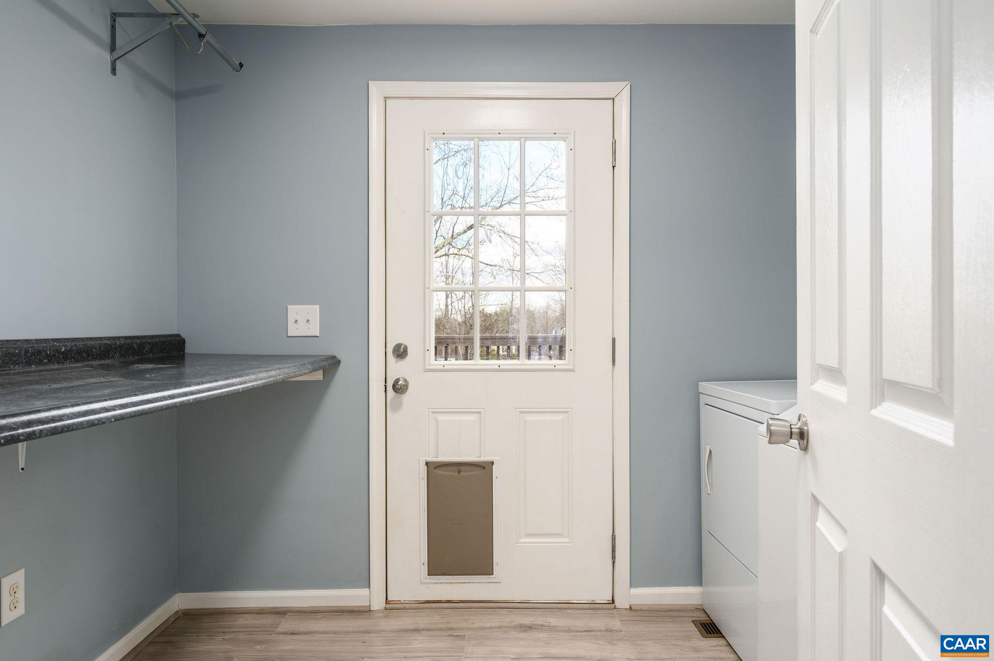 5029 Green Creek Road Schuyler, VA 22969 - Photo 9 of 27 a view of an empty room with a window and wooden floor