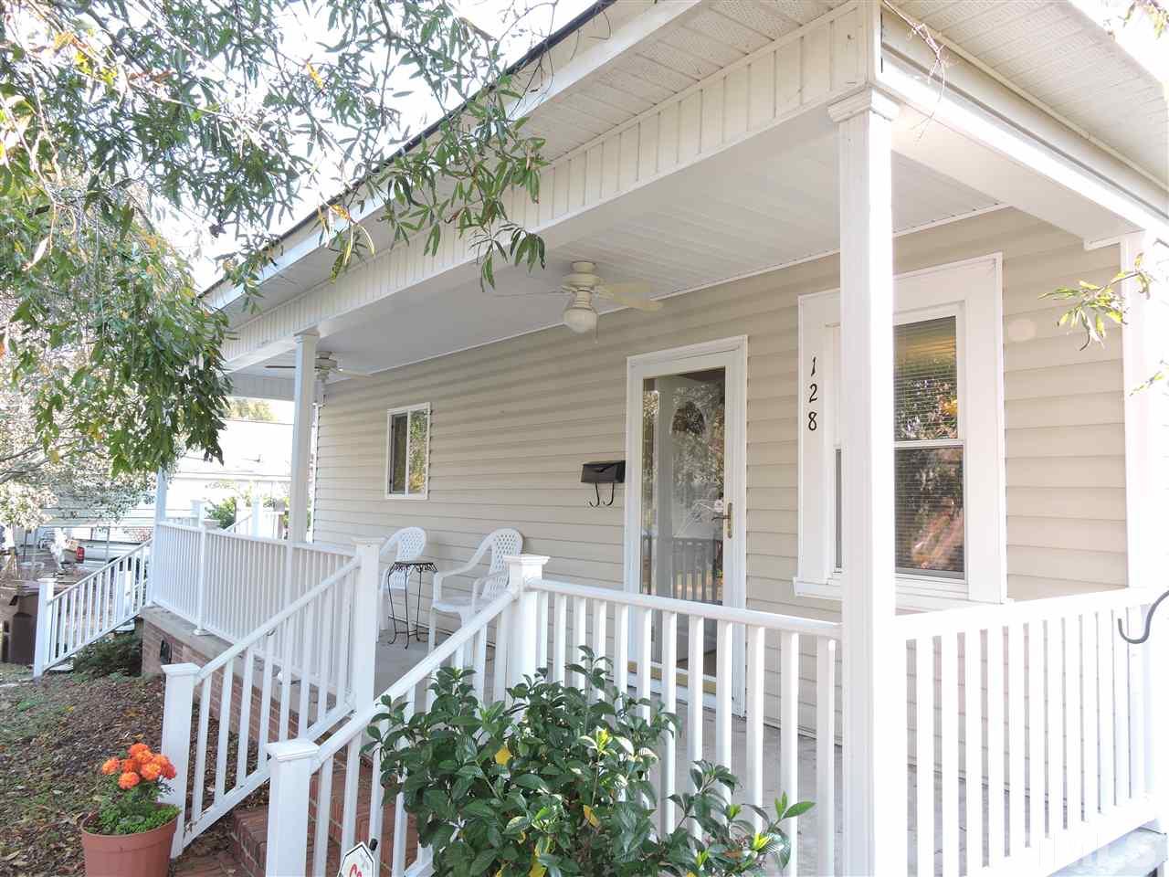 128 Allgood Street Roxboro, NC 27573 - Photo 1 of 17 a view of a house with a small yard and wooden floor and fence
